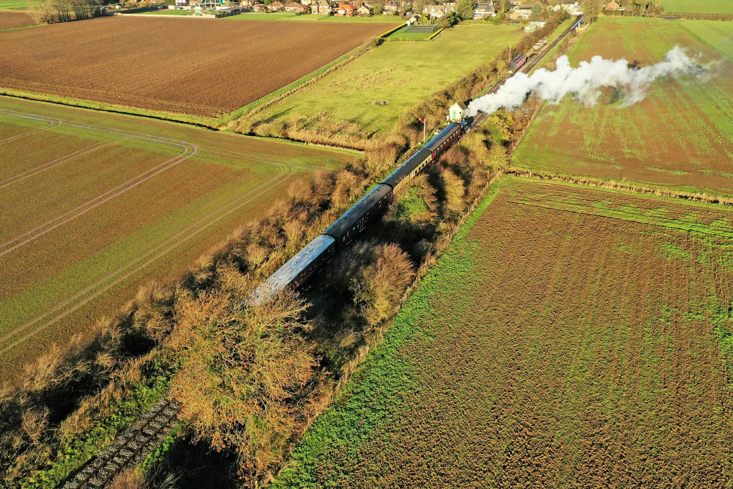 A steam train crossing the Lincolnshire countryside, seen from the air
