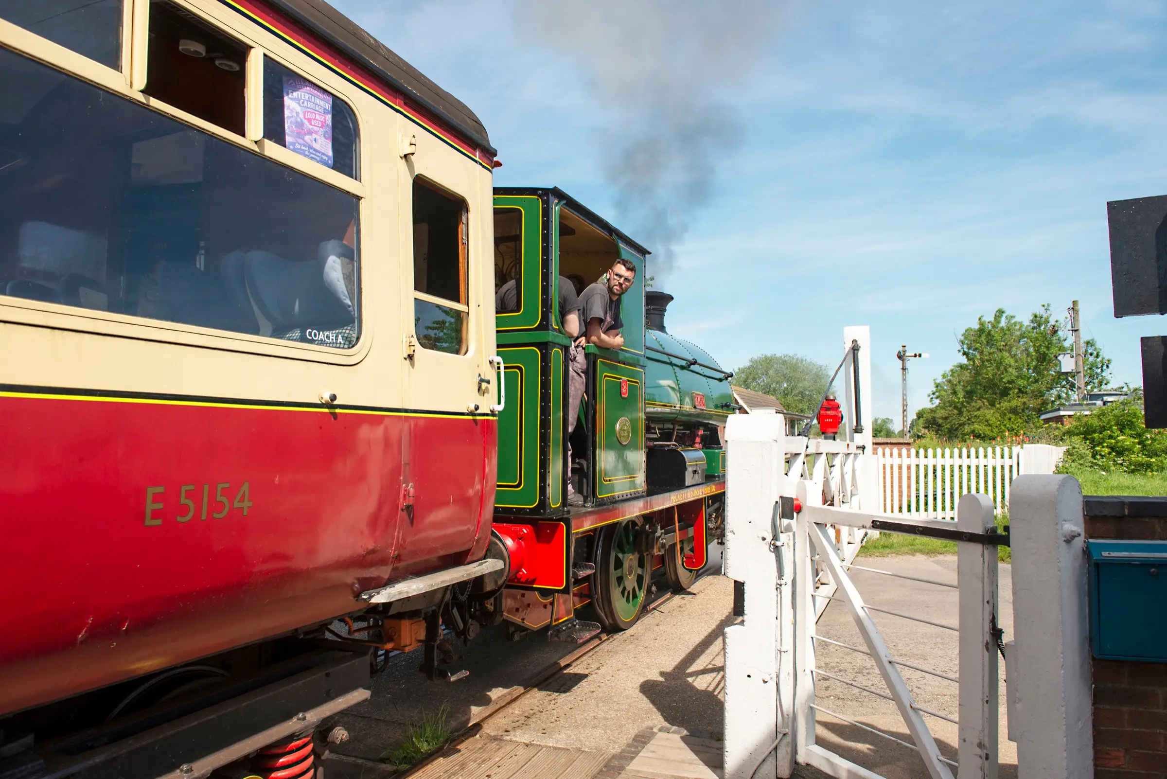 A steam locomotive and heritage coach at Ludborough station