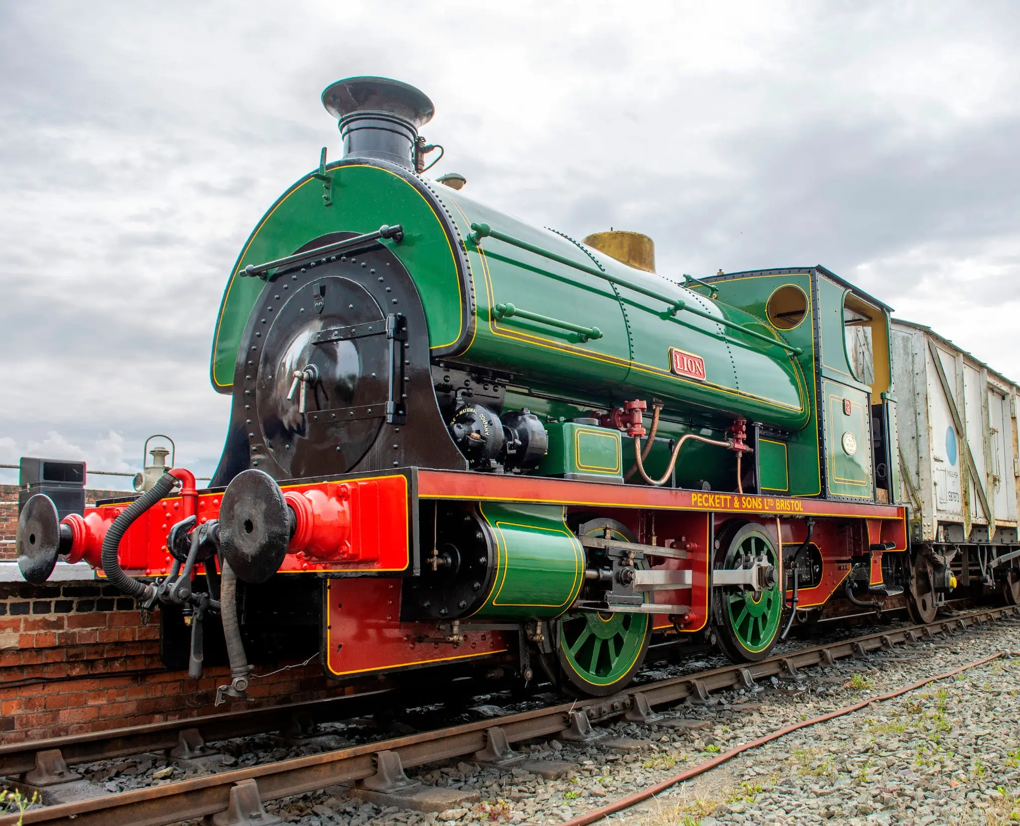 A restored green Peckett saddle-tank locomotive